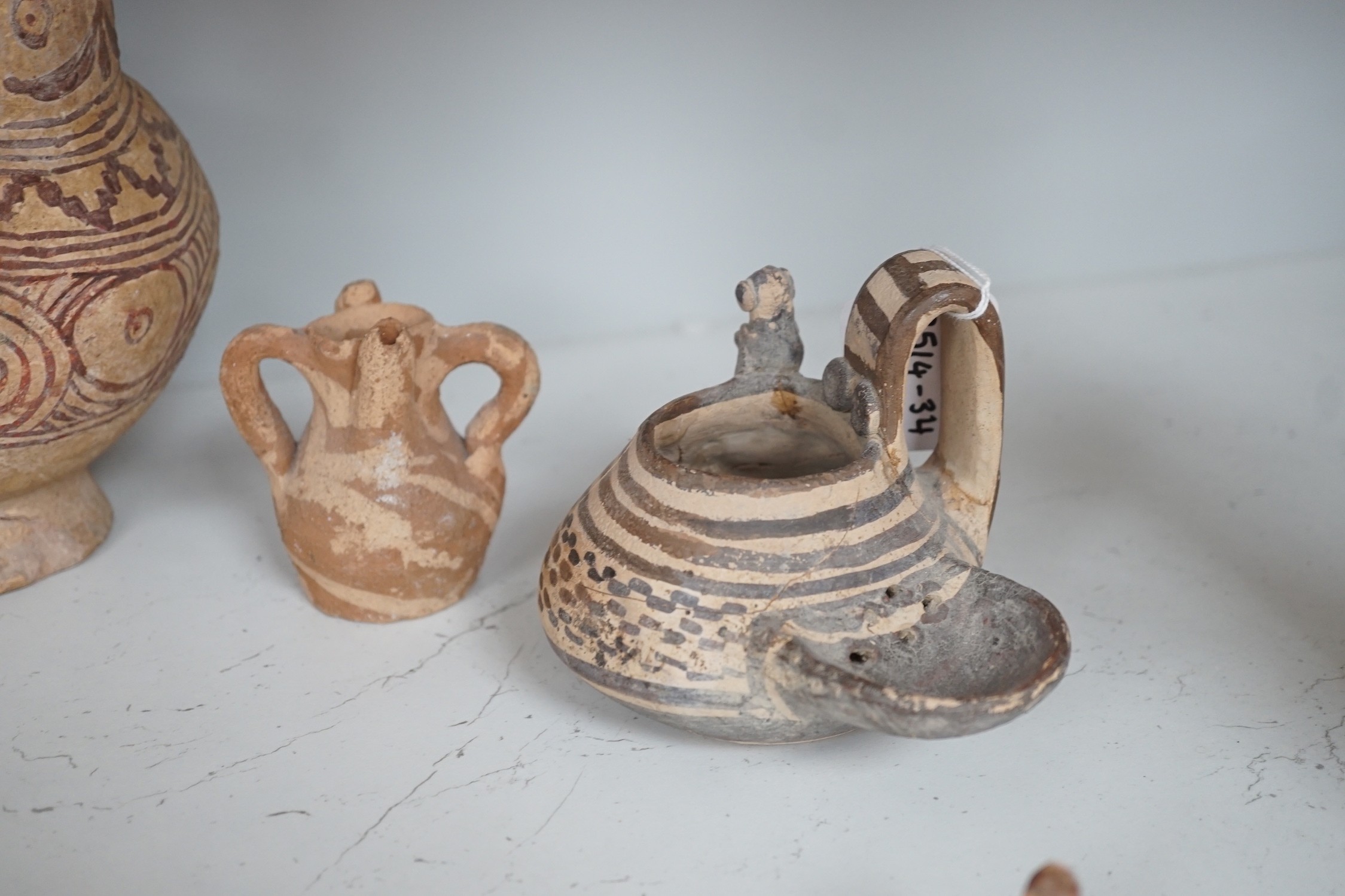 A selection of early Pre-Colombian, and other ceramics, to include an unusual vessel. Tallest 26cm